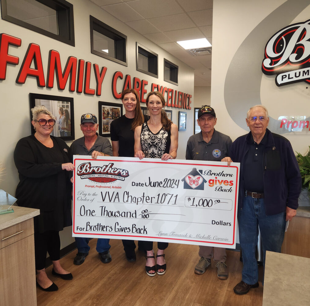 VVA Chapter 1071 accepting a Big Check for $1000 from Lynn & Michelle the sisters from Brothers.