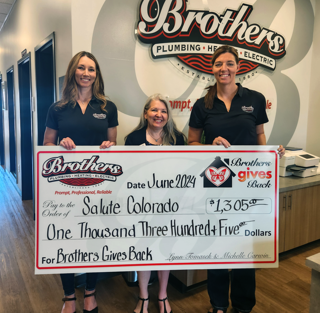 Lynn & Michelle (The Sisters from Brothers) presenting a check for $1305 to Salute Colorado