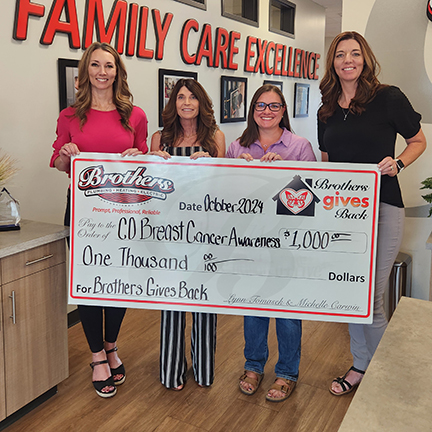 Lynn & Michelle, the Sisters from Brothers presenting a check to the Colorado Breast Cancer Awareness Foundation